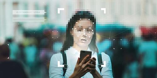 photo of woman on her smart phone having her face scanned